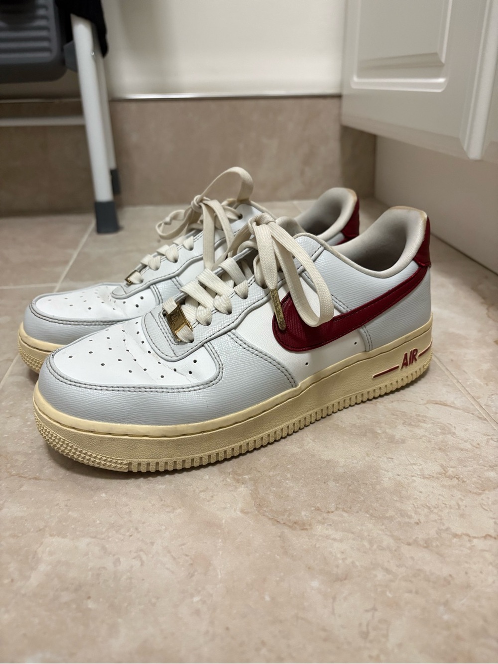 Nike Kids White Sneakers with Red Swoosh and Cream Sole